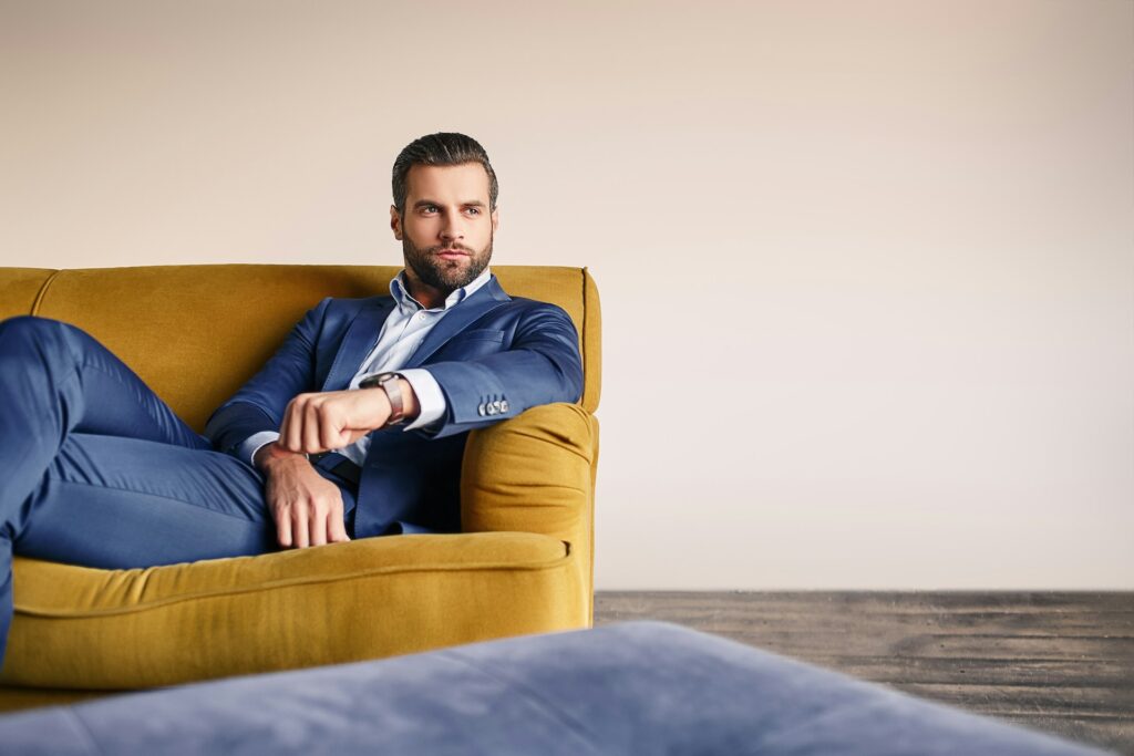 man sitting on sofa