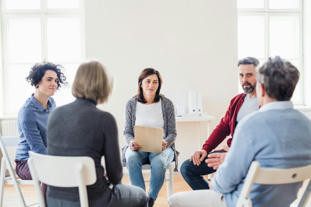 people talking at group therapy