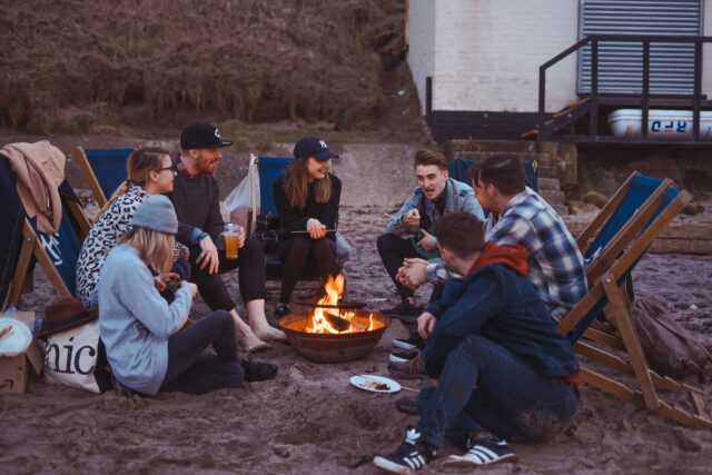 friends at campfire at night