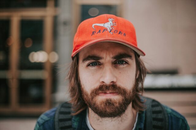 serious man in trucker hat