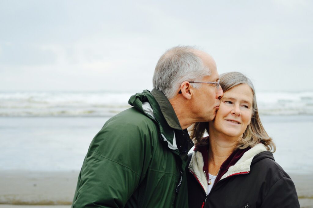 older couple on winter beach