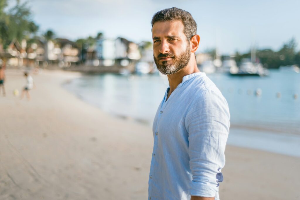 man standing alone on beach