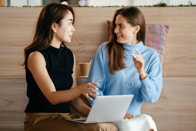 two female colleagues talking